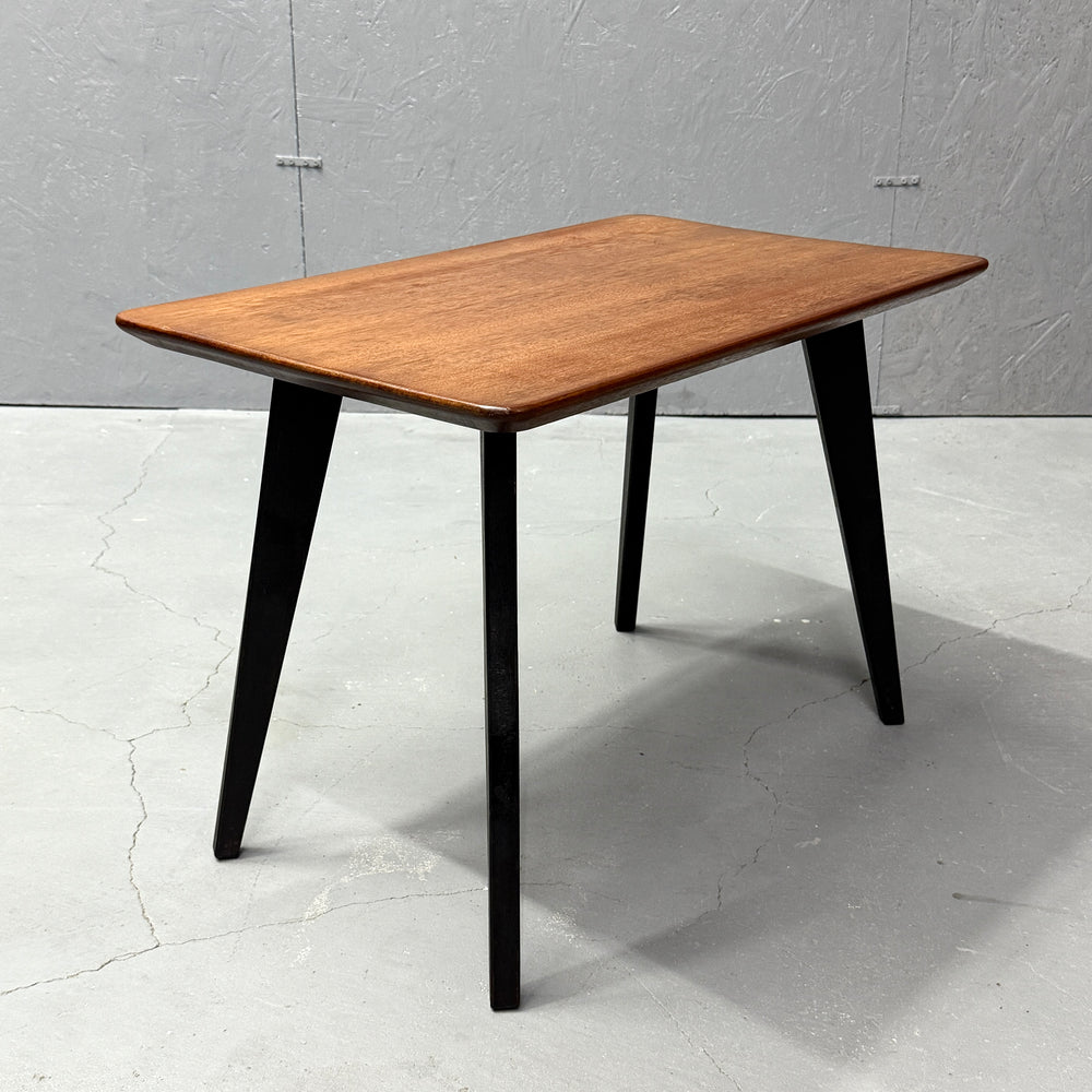 
                      
                        Coffee table with black legs
                      
                    